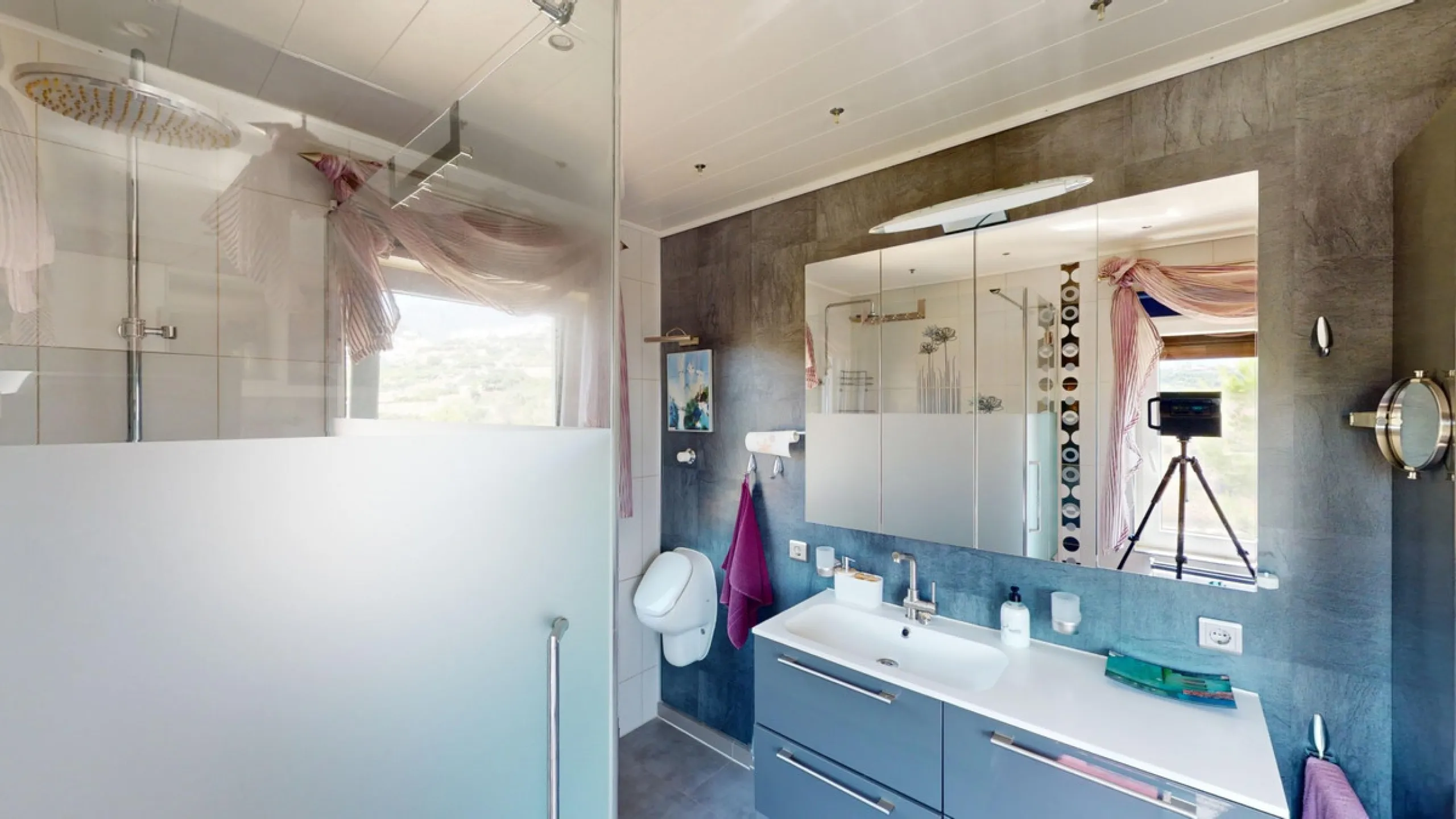 Stunning Villa Below Frigiliana for Sale. This impressive villa, nestled below Frigiliana, offers two separate living units across two floors, each with its own driveway and privacy. The upper unit spans 150 m2 and features a spacious open-plan living and
