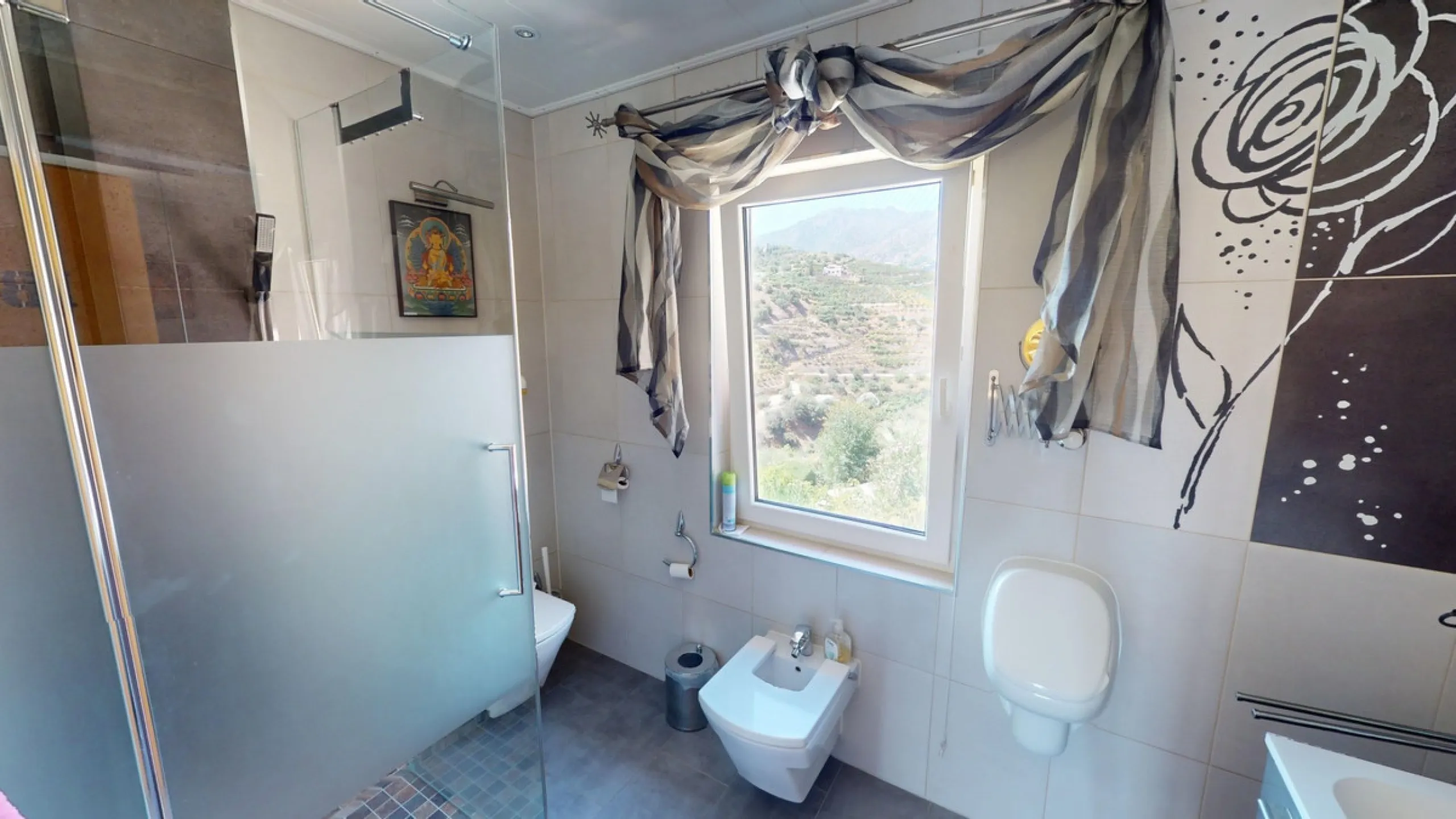 Stunning Villa Below Frigiliana for Sale. This impressive villa, nestled below Frigiliana, offers two separate living units across two floors, each with its own driveway and privacy. The upper unit spans 150 m2 and features a spacious open-plan living and