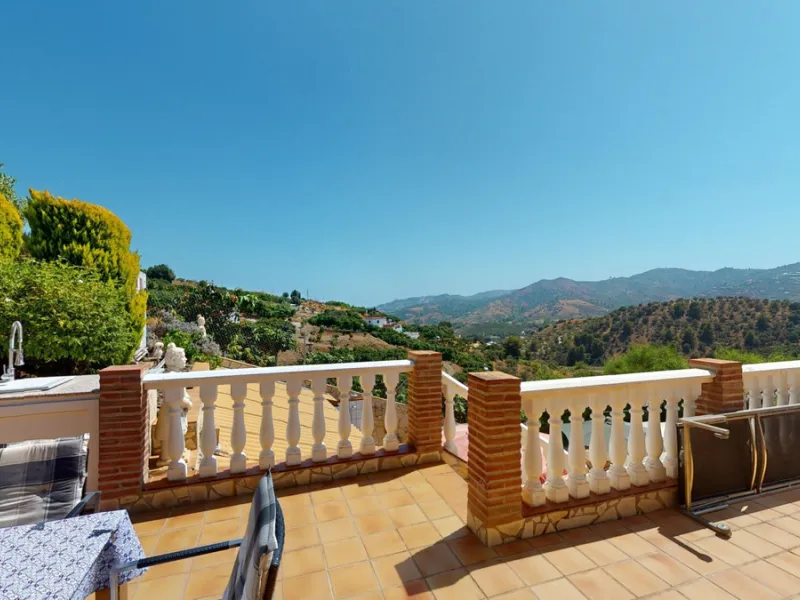 Stunning Villa Below Frigiliana for Sale. This impressive villa, nestled below Frigiliana, offers two separate living units across two floors, each with its own driveway and privacy. The upper unit spans 150 m2 and features a spacious open-plan living and