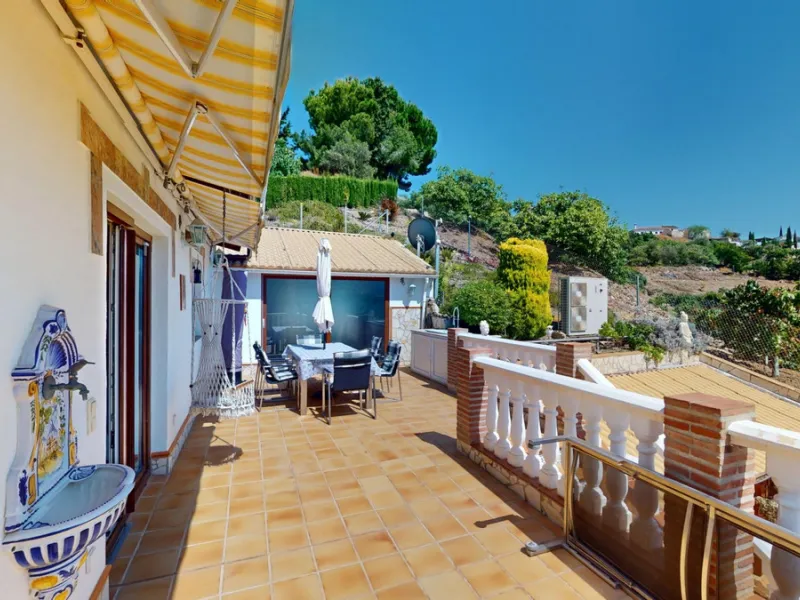 Stunning Villa Below Frigiliana for Sale. This impressive villa, nestled below Frigiliana, offers two separate living units across two floors, each with its own driveway and privacy. The upper unit spans 150 m2 and features a spacious open-plan living and