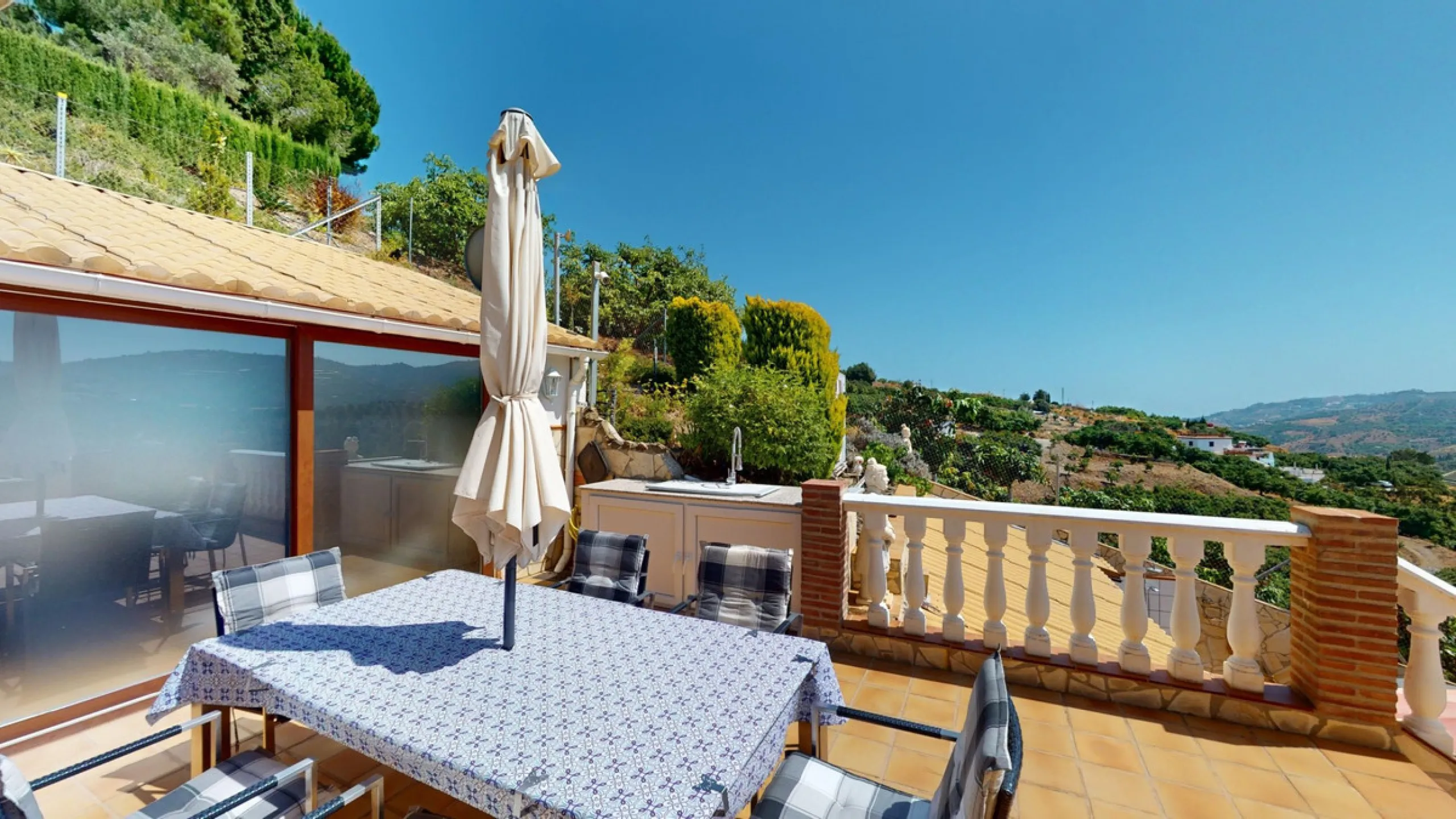 Stunning Villa Below Frigiliana for Sale. This impressive villa, nestled below Frigiliana, offers two separate living units across two floors, each with its own driveway and privacy. The upper unit spans 150 m2 and features a spacious open-plan living and