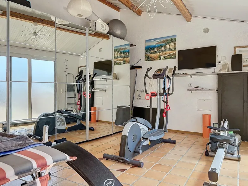Stunning Villa Below Frigiliana for Sale. This impressive villa, nestled below Frigiliana, offers two separate living units across two floors, each with its own driveway and privacy. The upper unit spans 150 m2 and features a spacious open-plan living and