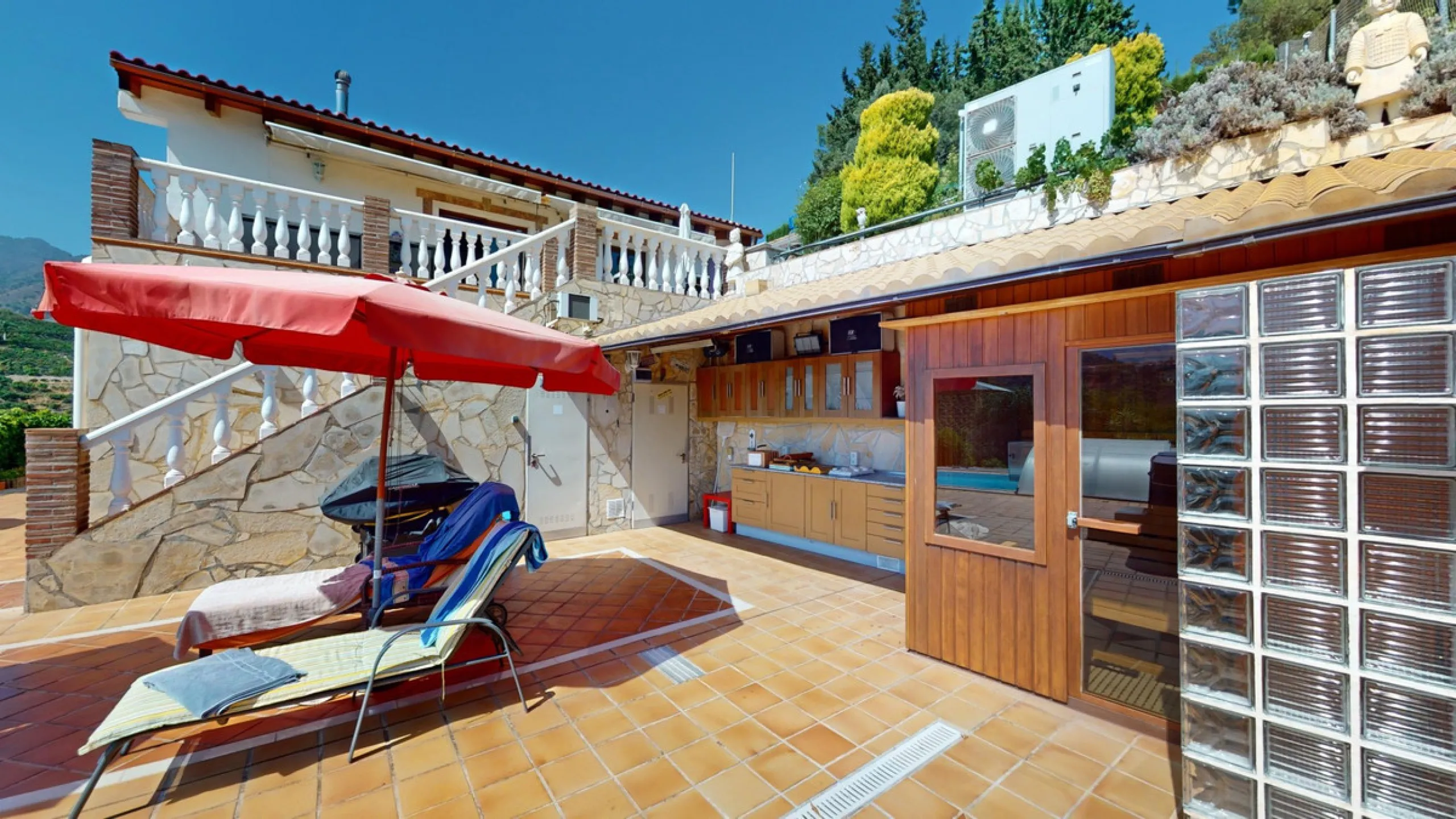 Stunning Villa Below Frigiliana for Sale. This impressive villa, nestled below Frigiliana, offers two separate living units across two floors, each with its own driveway and privacy. The upper unit spans 150 m2 and features a spacious open-plan living and