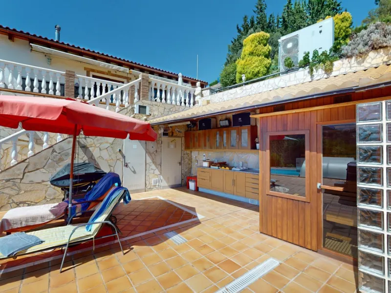 Stunning Villa Below Frigiliana for Sale. This impressive villa, nestled below Frigiliana, offers two separate living units across two floors, each with its own driveway and privacy. The upper unit spans 150 m2 and features a spacious open-plan living and