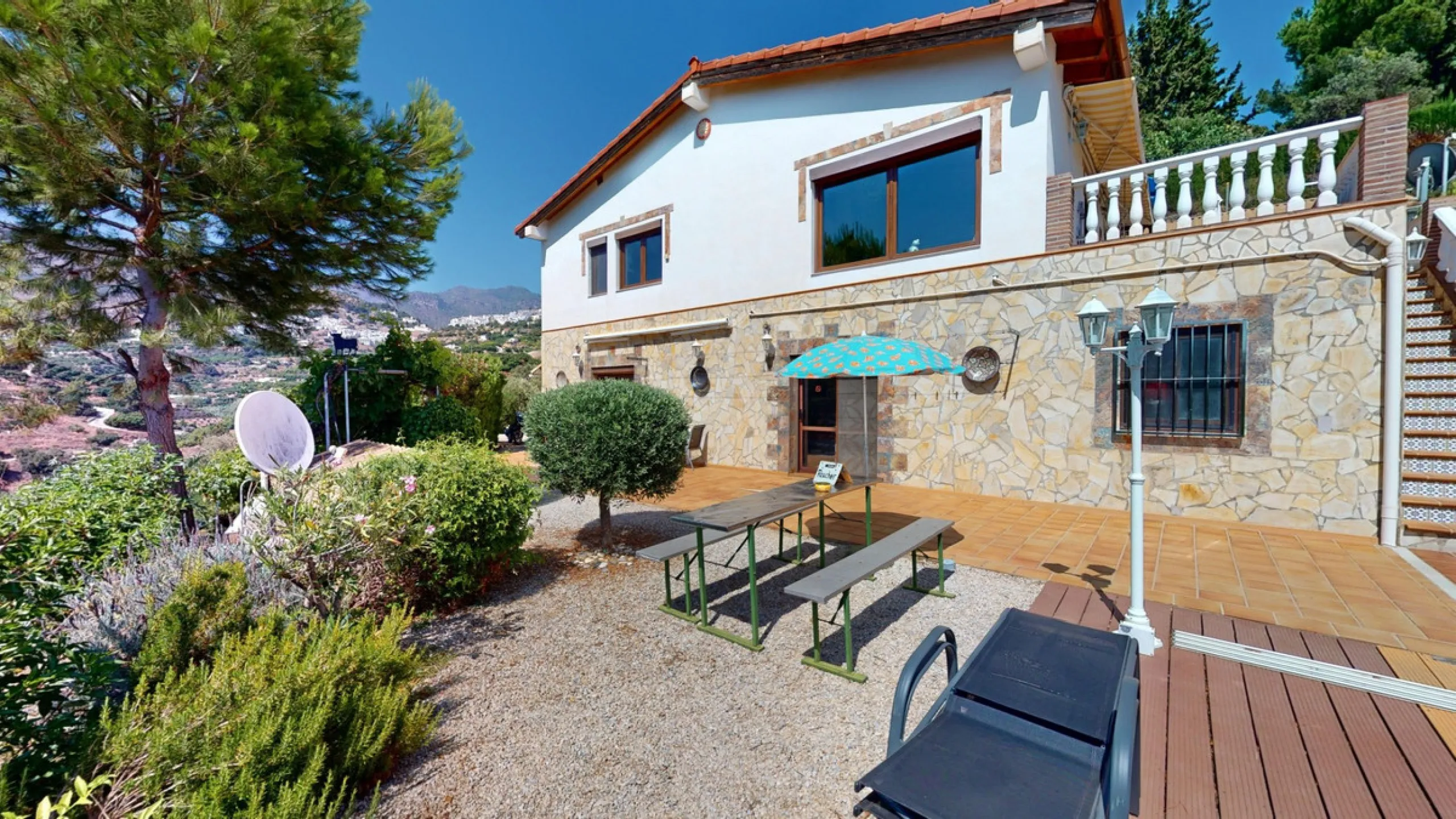 Stunning Villa Below Frigiliana for Sale. This impressive villa, nestled below Frigiliana, offers two separate living units across two floors, each with its own driveway and privacy. The upper unit spans 150 m2 and features a spacious open-plan living and