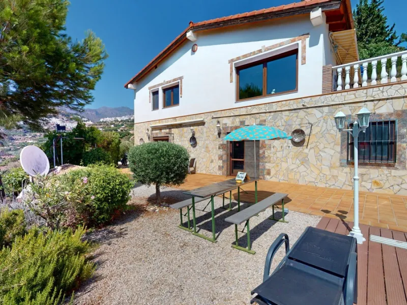 Stunning Villa Below Frigiliana for Sale. This impressive villa, nestled below Frigiliana, offers two separate living units across two floors, each with its own driveway and privacy. The upper unit spans 150 m2 and features a spacious open-plan living and