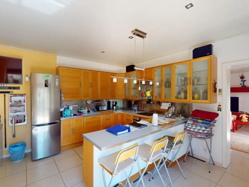 Stunning Villa Below Frigiliana for Sale. This impressive villa, nestled below Frigiliana, offers two separate living units across two floors, each with its own driveway and privacy. The upper unit spans 150 m2 and features a spacious open-plan living and
