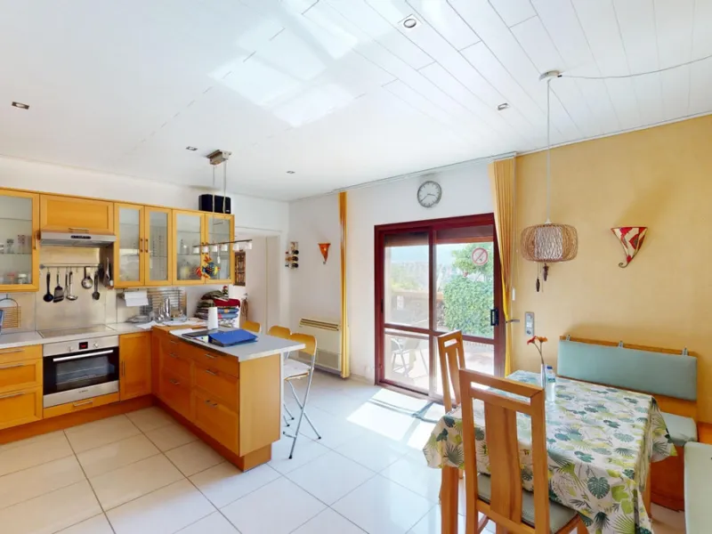 Stunning Villa Below Frigiliana for Sale. This impressive villa, nestled below Frigiliana, offers two separate living units across two floors, each with its own driveway and privacy. The upper unit spans 150 m2 and features a spacious open-plan living and