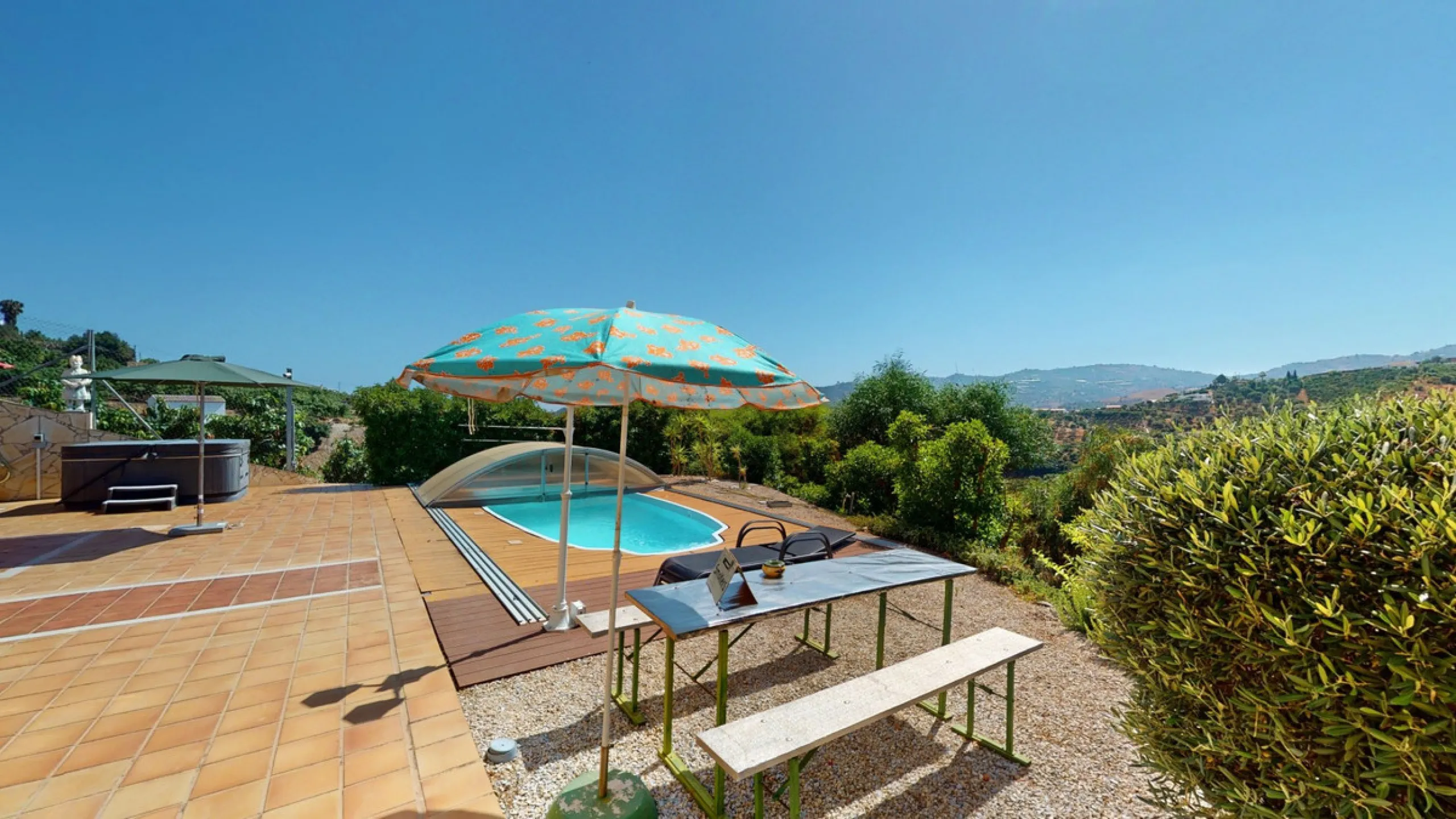 Stunning Villa Below Frigiliana for Sale. This impressive villa, nestled below Frigiliana, offers two separate living units across two floors, each with its own driveway and privacy. The upper unit spans 150 m2 and features a spacious open-plan living and