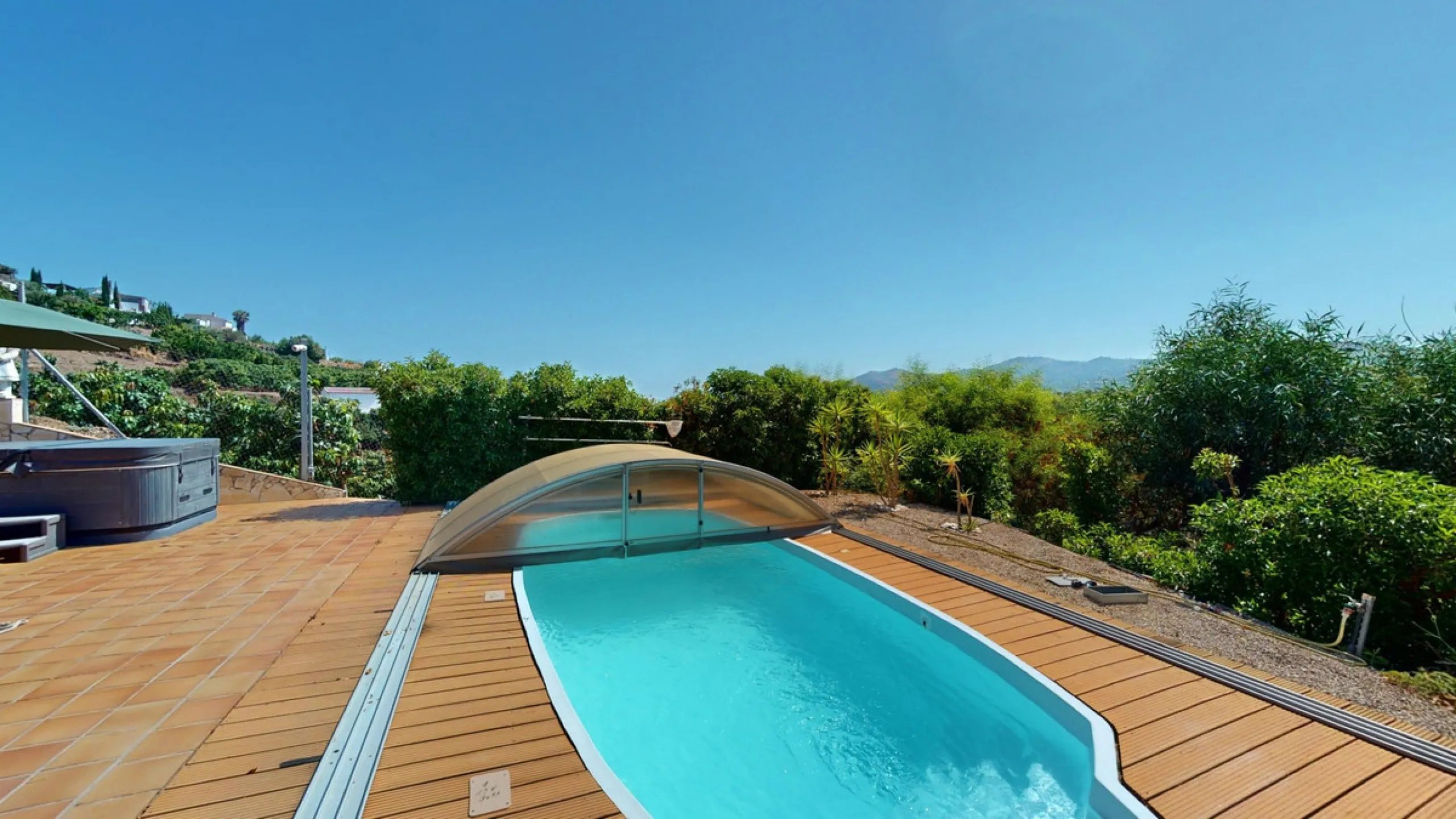 Stunning Villa Below Frigiliana for Sale. This impressive villa, nestled below Frigiliana, offers two separate living units across two floors, each with its own driveway and privacy. The upper unit spans 150 m2 and features a spacious open-plan living and