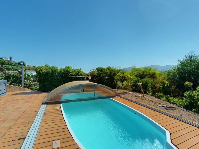 Stunning Villa Below Frigiliana for Sale. This impressive villa, nestled below Frigiliana, offers two separate living units across two floors, each with its own driveway and privacy. The upper unit spans 150 m2 and features a spacious open-plan living and