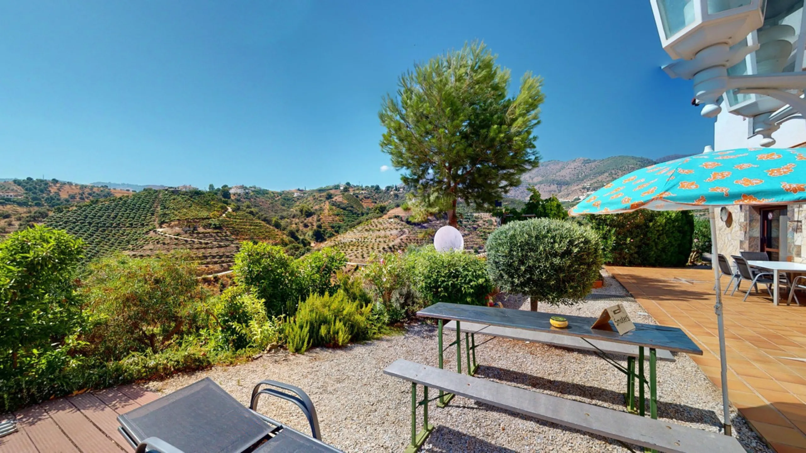 Stunning Villa Below Frigiliana for Sale. This impressive villa, nestled below Frigiliana, offers two separate living units across two floors, each with its own driveway and privacy. The upper unit spans 150 m2 and features a spacious open-plan living and