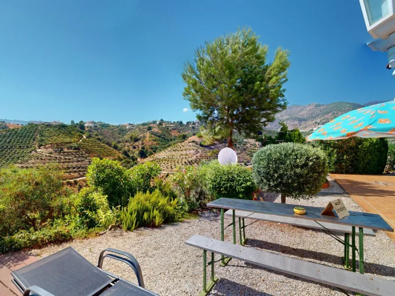 Stunning Villa Below Frigiliana for Sale. This impressive villa, nestled below Frigiliana, offers two separate living units across two floors, each with its own driveway and privacy. The upper unit spans 150 m2 and features a spacious open-plan living and