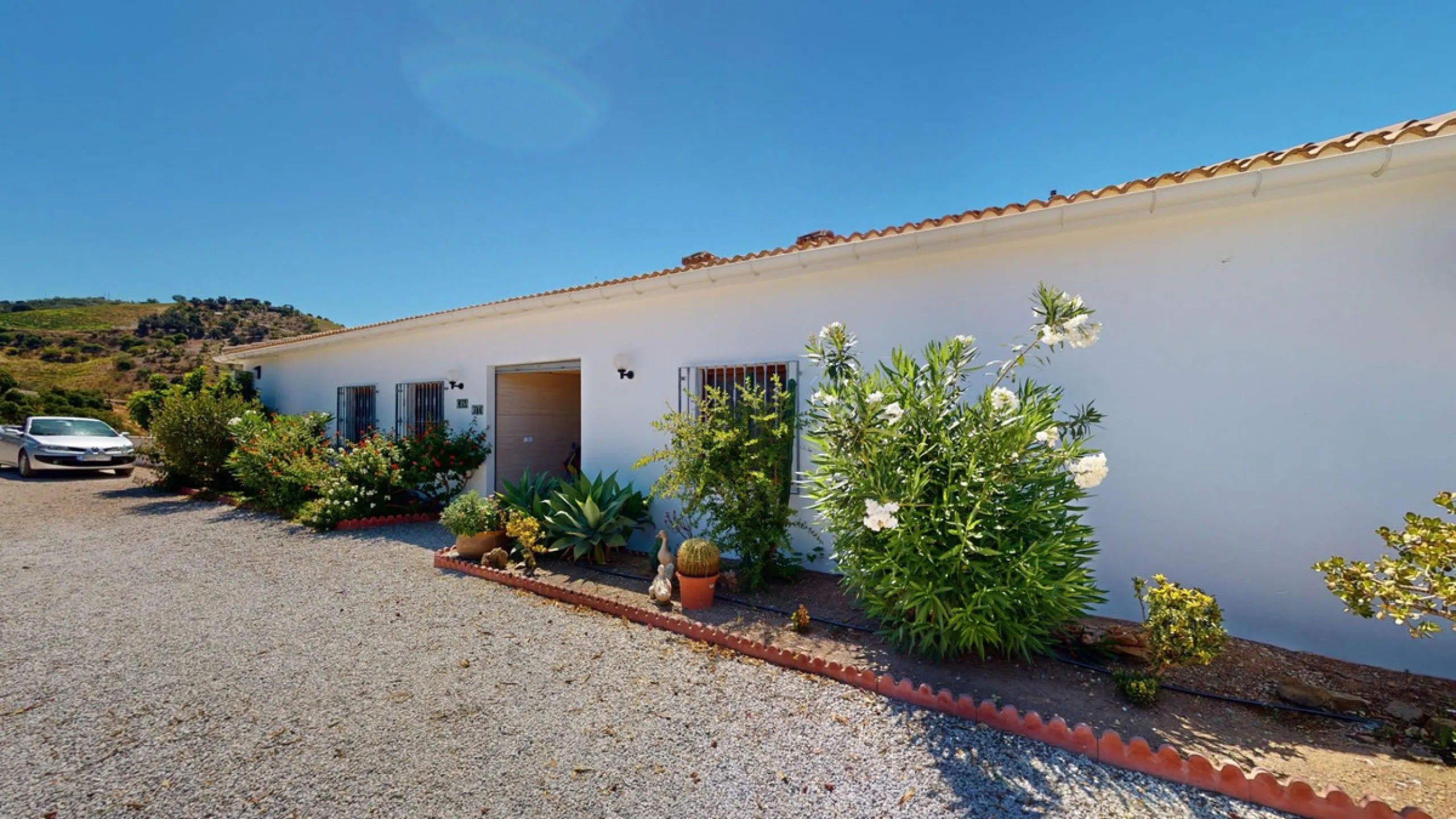 This exceptional, spacious U-shaped villa is located in the picturesque area of Iznate and offers two separate living units, each fully equipped. The villa spans two floors and features a total of seven bedrooms and six bathrooms. Each unit includes a fun