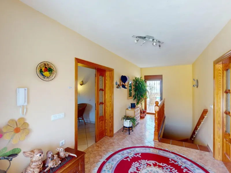 This exceptional, spacious U-shaped villa is located in the picturesque area of Iznate and offers two separate living units, each fully equipped. The villa spans two floors and features a total of seven bedrooms and six bathrooms. Each unit includes a fun