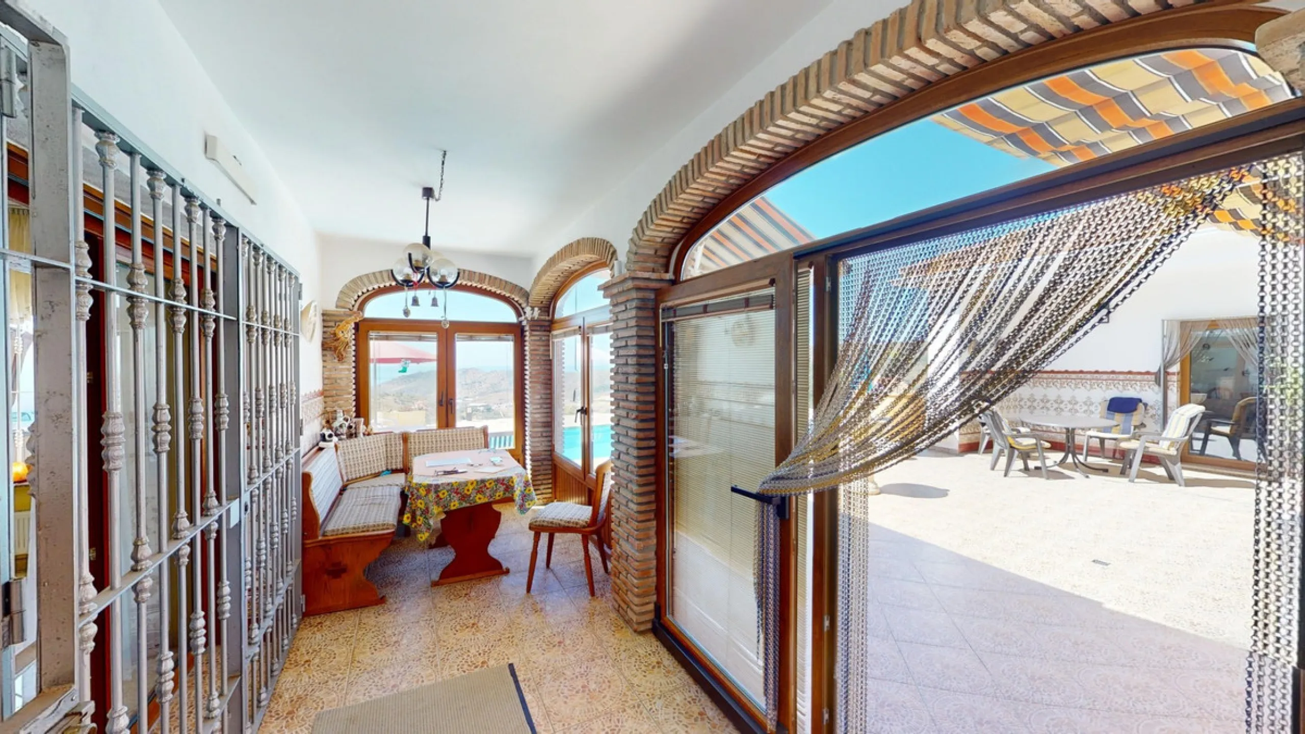 This exceptional, spacious U-shaped villa is located in the picturesque area of Iznate and offers two separate living units, each fully equipped. The villa spans two floors and features a total of seven bedrooms and six bathrooms. Each unit includes a fun