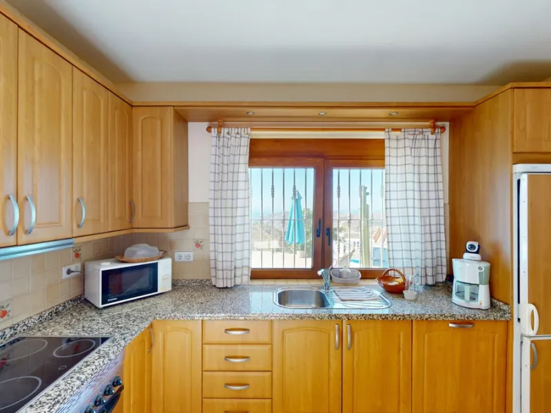 This exceptional, spacious U-shaped villa is located in the picturesque area of Iznate and offers two separate living units, each fully equipped. The villa spans two floors and features a total of seven bedrooms and six bathrooms. Each unit includes a fun