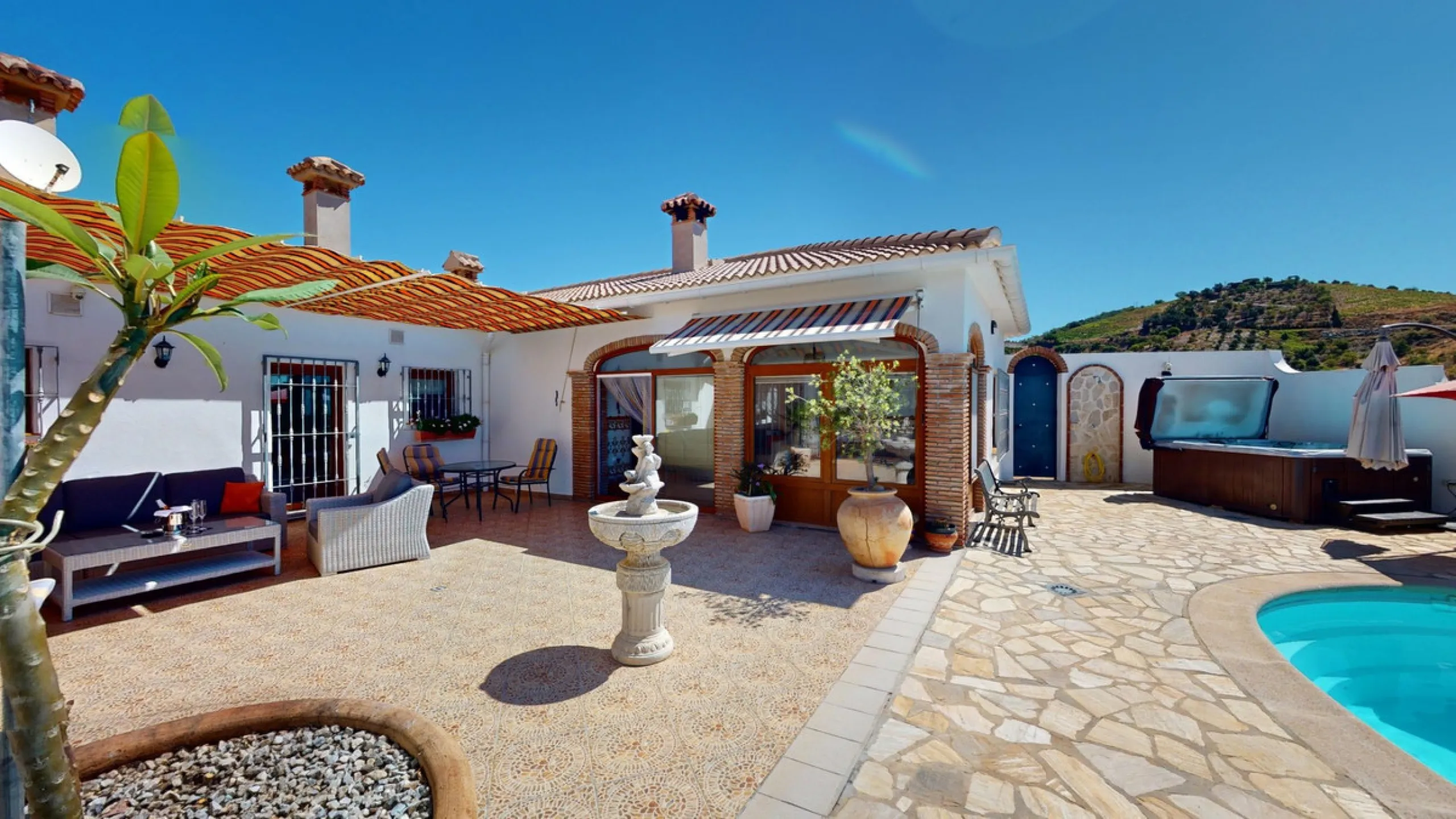 This exceptional, spacious U-shaped villa is located in the picturesque area of Iznate and offers two separate living units, each fully equipped. The villa spans two floors and features a total of seven bedrooms and six bathrooms. Each unit includes a fun