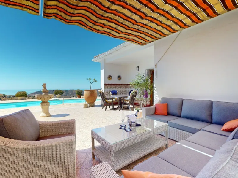 This exceptional, spacious U-shaped villa is located in the picturesque area of Iznate and offers two separate living units, each fully equipped. The villa spans two floors and features a total of seven bedrooms and six bathrooms. Each unit includes a fun