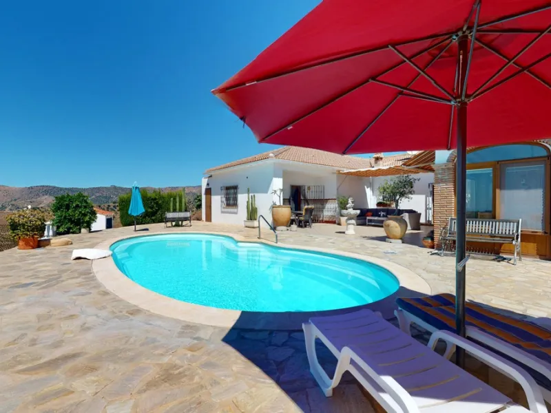 This exceptional, spacious U-shaped villa is located in the picturesque area of Iznate and offers two separate living units, each fully equipped. The villa spans two floors and features a total of seven bedrooms and six bathrooms. Each unit includes a fun