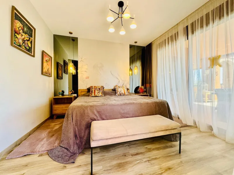 The property boasts an elegant layout and well-defined spaces. It features a closed area of one hundred forty-four meters and forty square decimeters, complemented by a covered terrace of sixty meters and nine square decimeters, and an uncovered terrace o