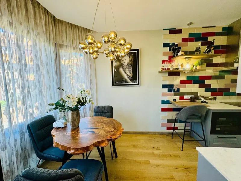 The property boasts an elegant layout and well-defined spaces. It features a closed area of one hundred forty-four meters and forty square decimeters, complemented by a covered terrace of sixty meters and nine square decimeters, and an uncovered terrace o