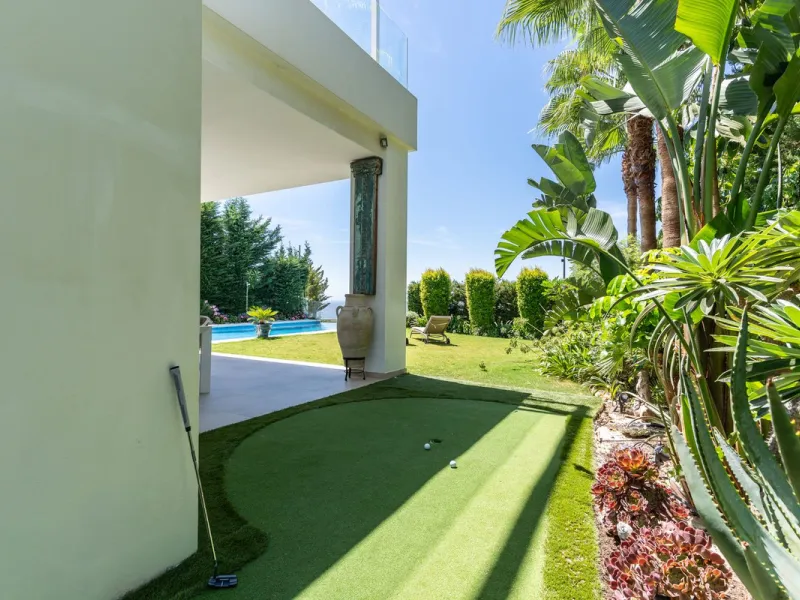 This exceptional luxury villa is situated in the prestigious area of Cabopino, Marbella East, offering a prime front line golf location with captivating views of both the sea and lush fairways. Designed to the highest standards, the property spans a gener