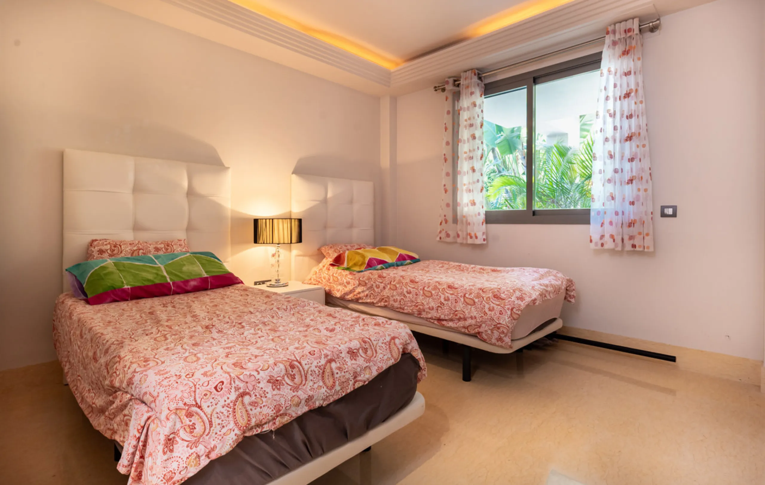 This modern apartment offers a range of features designed to enhance your living experience. The property boasts three bedrooms, each with its own en-suite bathroom, adding a touch of luxury. The apartment's west orientation allows for ample natural light