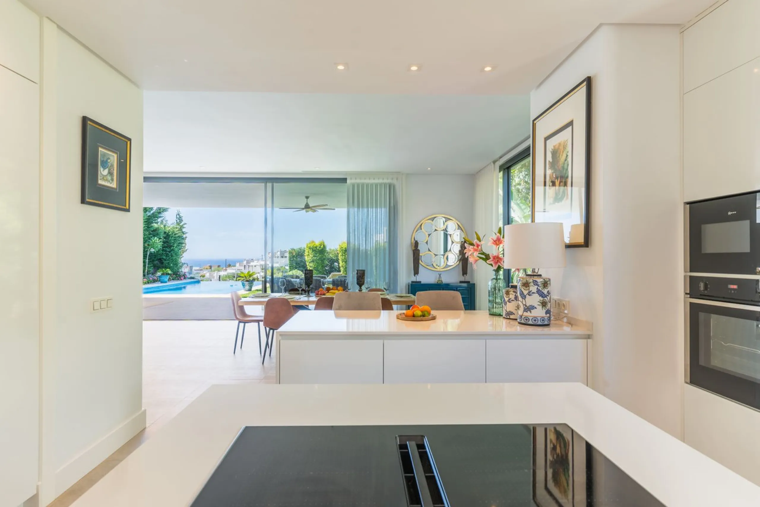 This exceptional luxury villa is situated in the prestigious area of Cabopino, Marbella East, offering a prime front line golf location with captivating views of both the sea and lush fairways. Designed to the highest standards, the property spans a gener