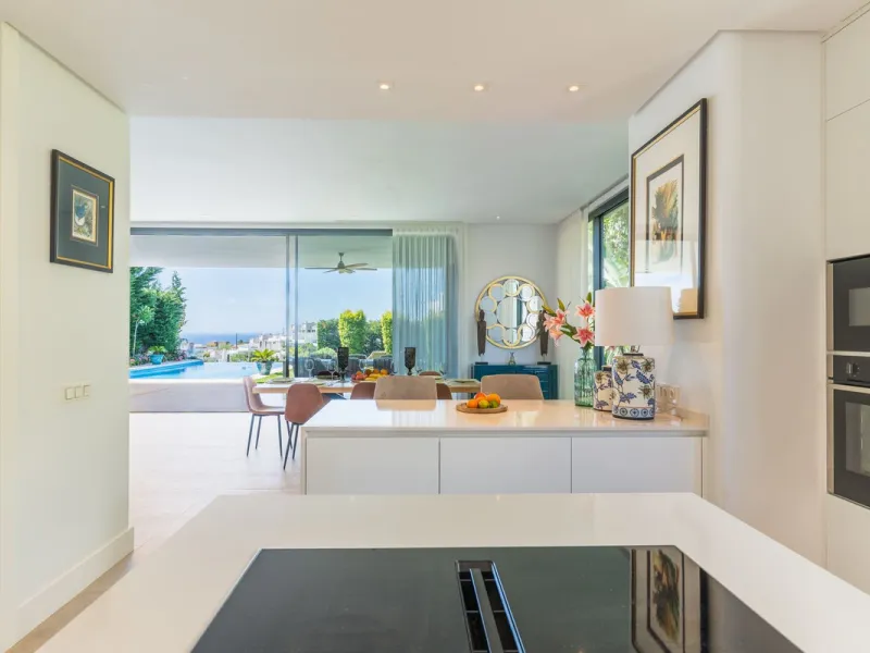 This exceptional luxury villa is situated in the prestigious area of Cabopino, Marbella East, offering a prime front line golf location with captivating views of both the sea and lush fairways. Designed to the highest standards, the property spans a gener