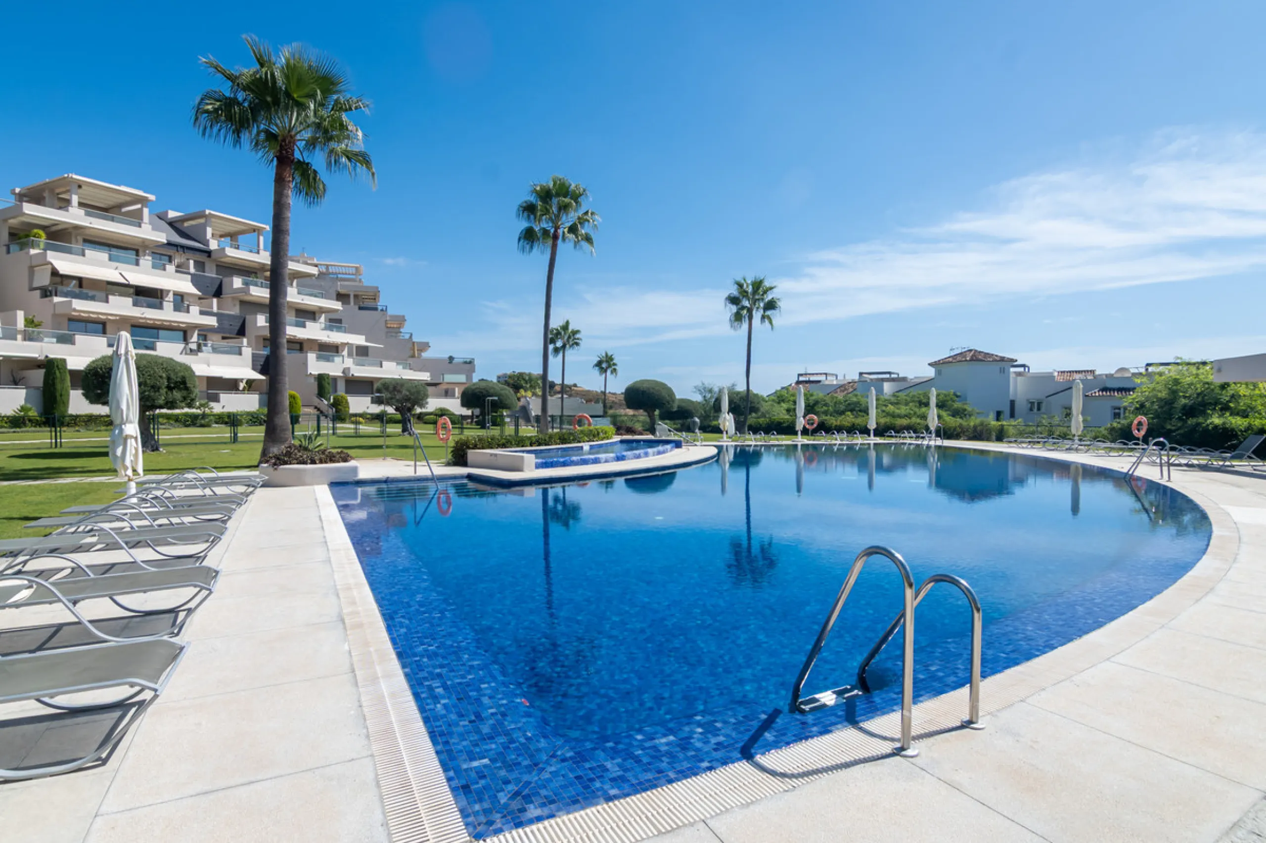 This modern apartment offers a range of features designed to enhance your living experience. The property boasts three bedrooms, each with its own en-suite bathroom, adding a touch of luxury. The apartment's west orientation allows for ample natural light