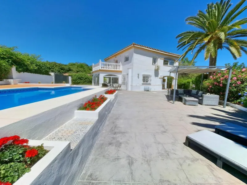 Spectacular detached villa with 3 separate living accommodations, situated in an extremely private location, walking distance to town.