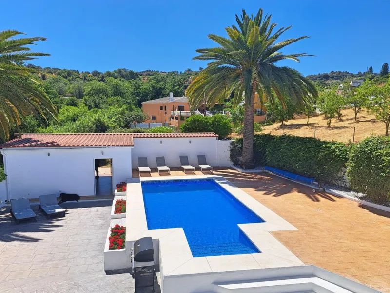 Spectacular detached villa with 3 separate living accommodations, situated in an extremely private location, walking distance to town.