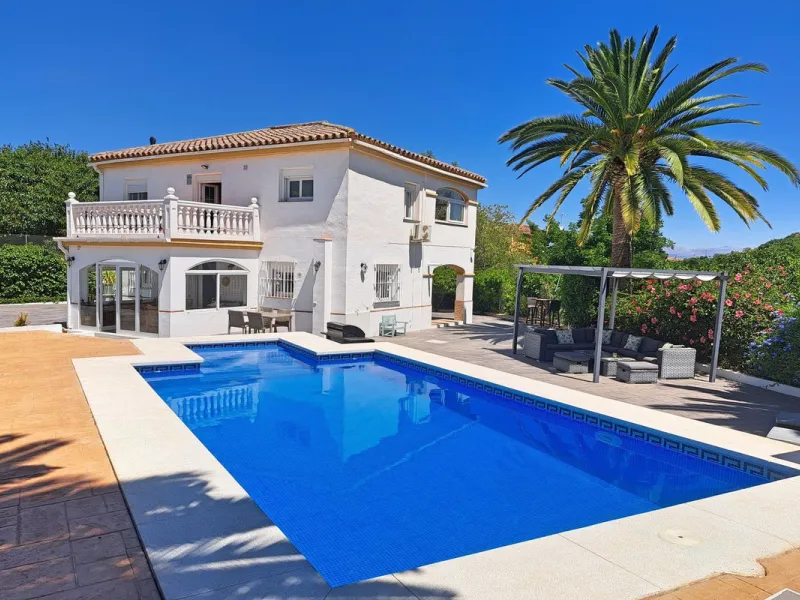 Spectacular detached villa with 3 separate living accommodations, situated in an extremely private location, walking distance to town.