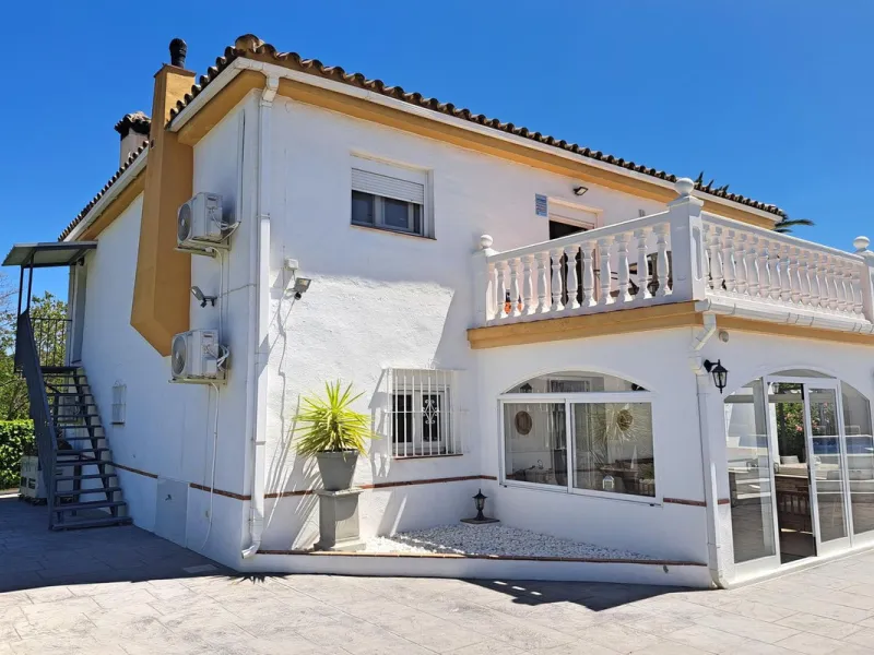 Spectacular detached villa with 3 separate living accommodations, situated in an extremely private location, walking distance to town.