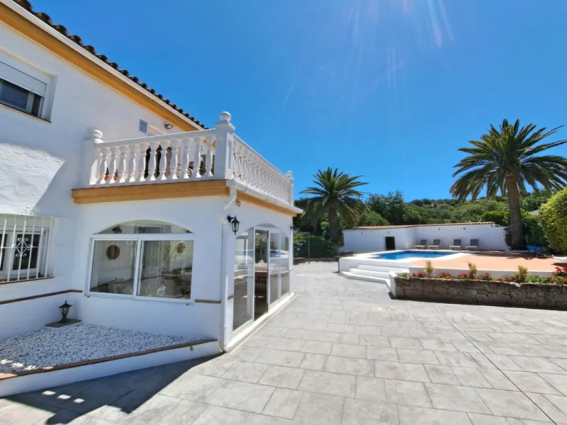 Spectacular detached villa with 3 separate living accommodations, situated in an extremely private location, walking distance to town.