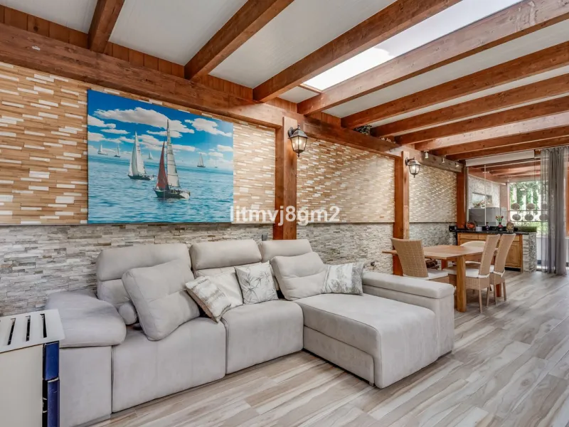This luxurious four-bedroom villa, located in the peaceful area of lower Artola / Hacienda Las Chapas, just 5 minuntes walk to the sea, is the epitome of elegance and comfort. Boasting a classic design with high-end finishes, the property features an abun