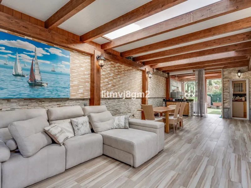 This luxurious four-bedroom villa, located in the peaceful area of lower Artola / Hacienda Las Chapas, just 5 minuntes walk to the sea, is the epitome of elegance and comfort. Boasting a classic design with high-end finishes, the property features an abun