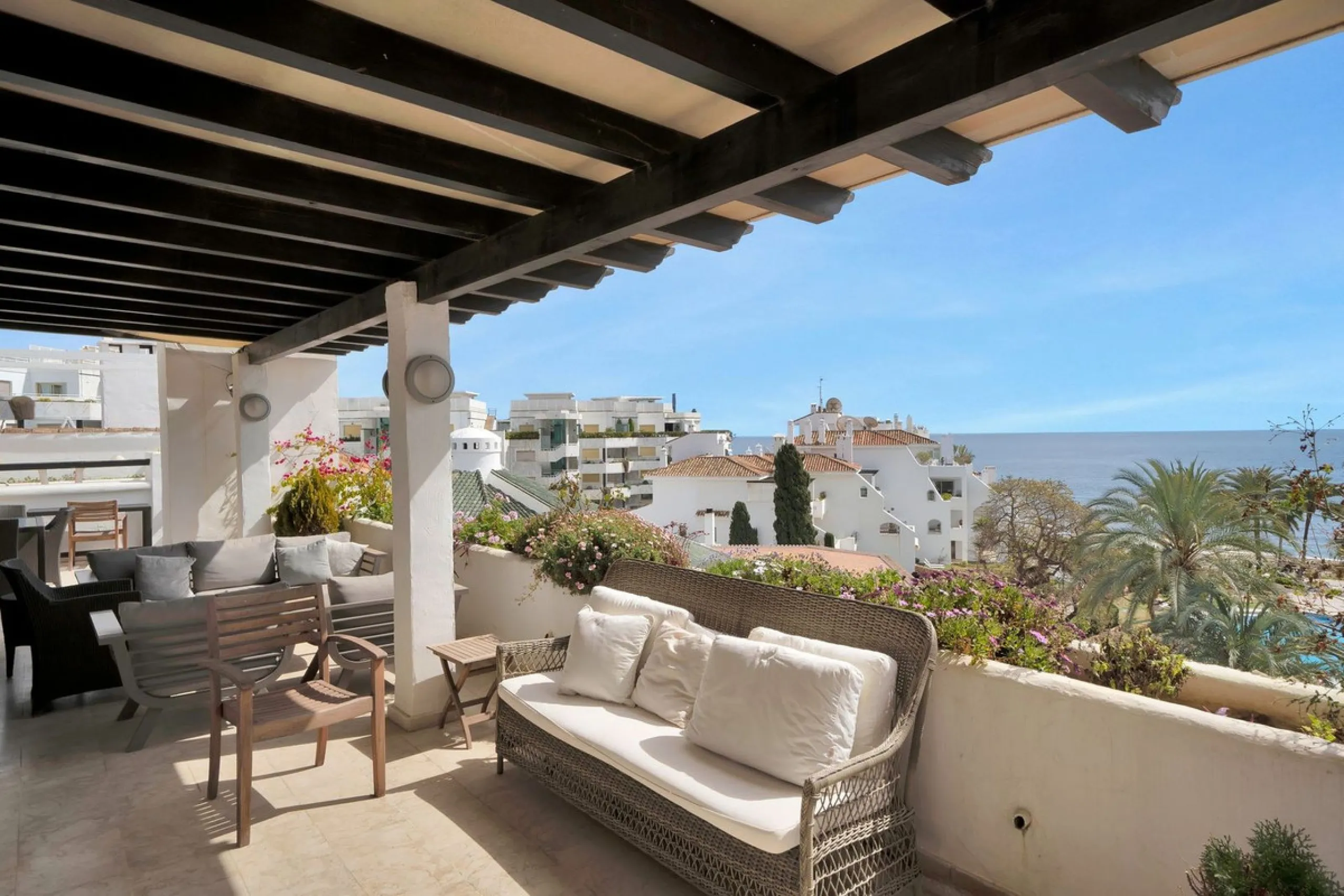 This luxurious penthouse, located on Marbella's prestigious Golden Mile in the Coral Beach complex, epitomizes beachfront living. The property features three spacious bedrooms and two elegant bathrooms, providing ample comfort and privacy. The highlight i