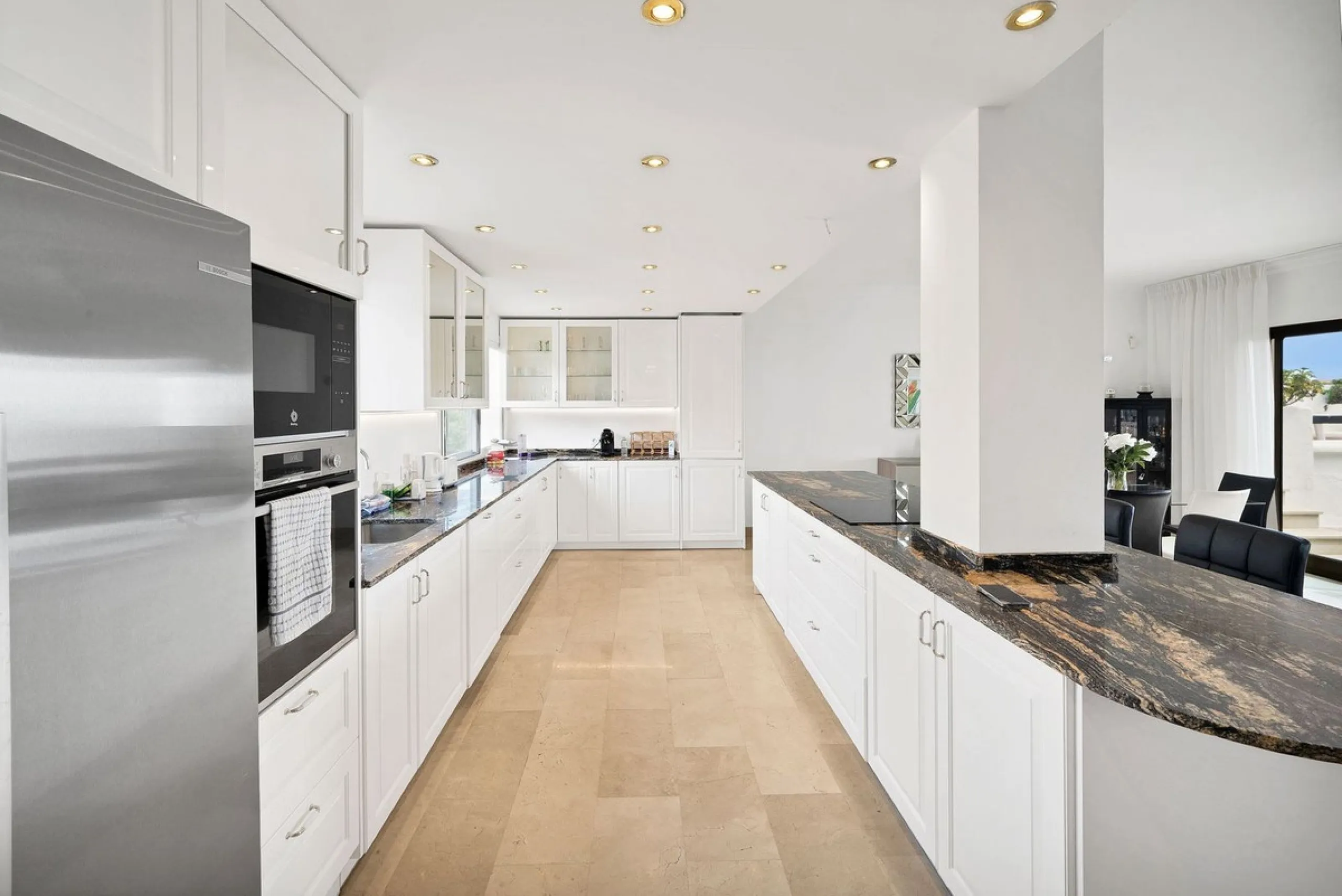 This luxurious penthouse, located on Marbella's prestigious Golden Mile in the Coral Beach complex, epitomizes beachfront living. The property features three spacious bedrooms and two elegant bathrooms, providing ample comfort and privacy. The highlight i