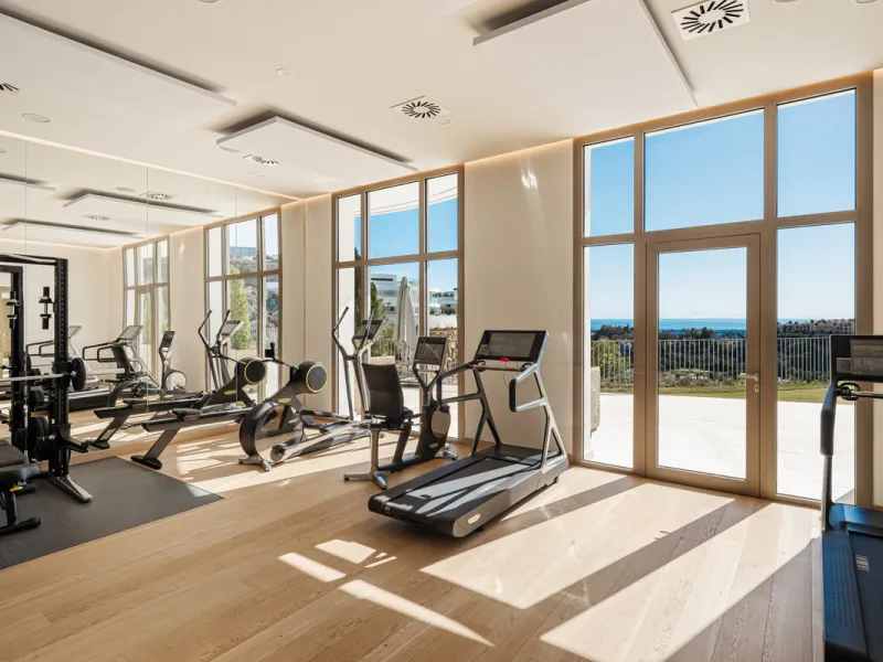Discover this modern 3-bedroom ground floor apartment in a new eco-friendly development in Benahavís, offering panoramic sea views. Situated within a gated resort-style community surrounded by lush landscaped gardens, this apartment embodies contemporary 