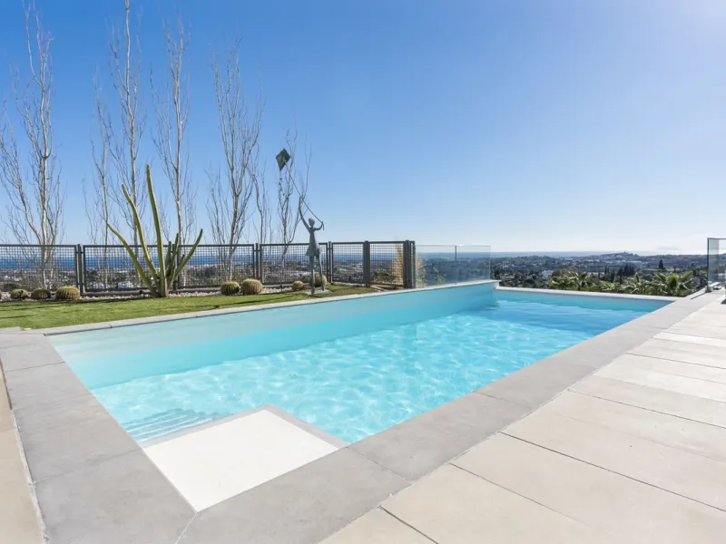 This property stands out as a true gem among modern, luxurious villas, gracefully placed in the exclusive gated community of El Herrojo in the esteemed locale of La Quinta. Elegantly perched atop a captivating hill, this exquisite residence offers a capti