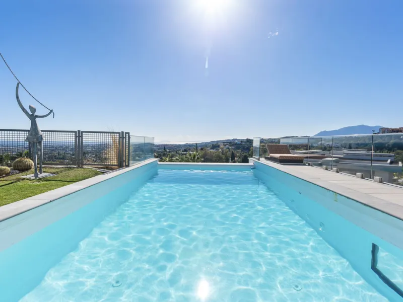 This property stands out as a true gem among modern, luxurious villas, gracefully placed in the exclusive gated community of El Herrojo in the esteemed locale of La Quinta. Elegantly perched atop a captivating hill, this exquisite residence offers a capti