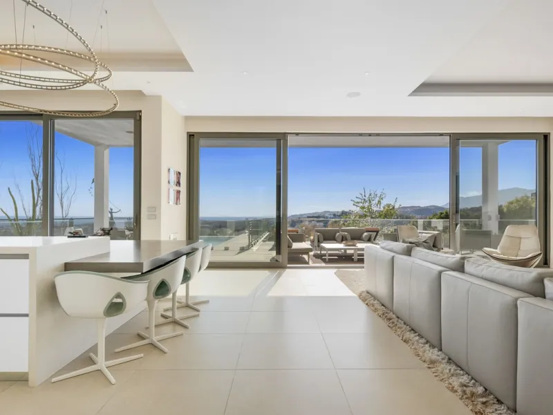 This property stands out as a true gem among modern, luxurious villas, gracefully placed in the exclusive gated community of El Herrojo in the esteemed locale of La Quinta. Elegantly perched atop a captivating hill, this exquisite residence offers a capti