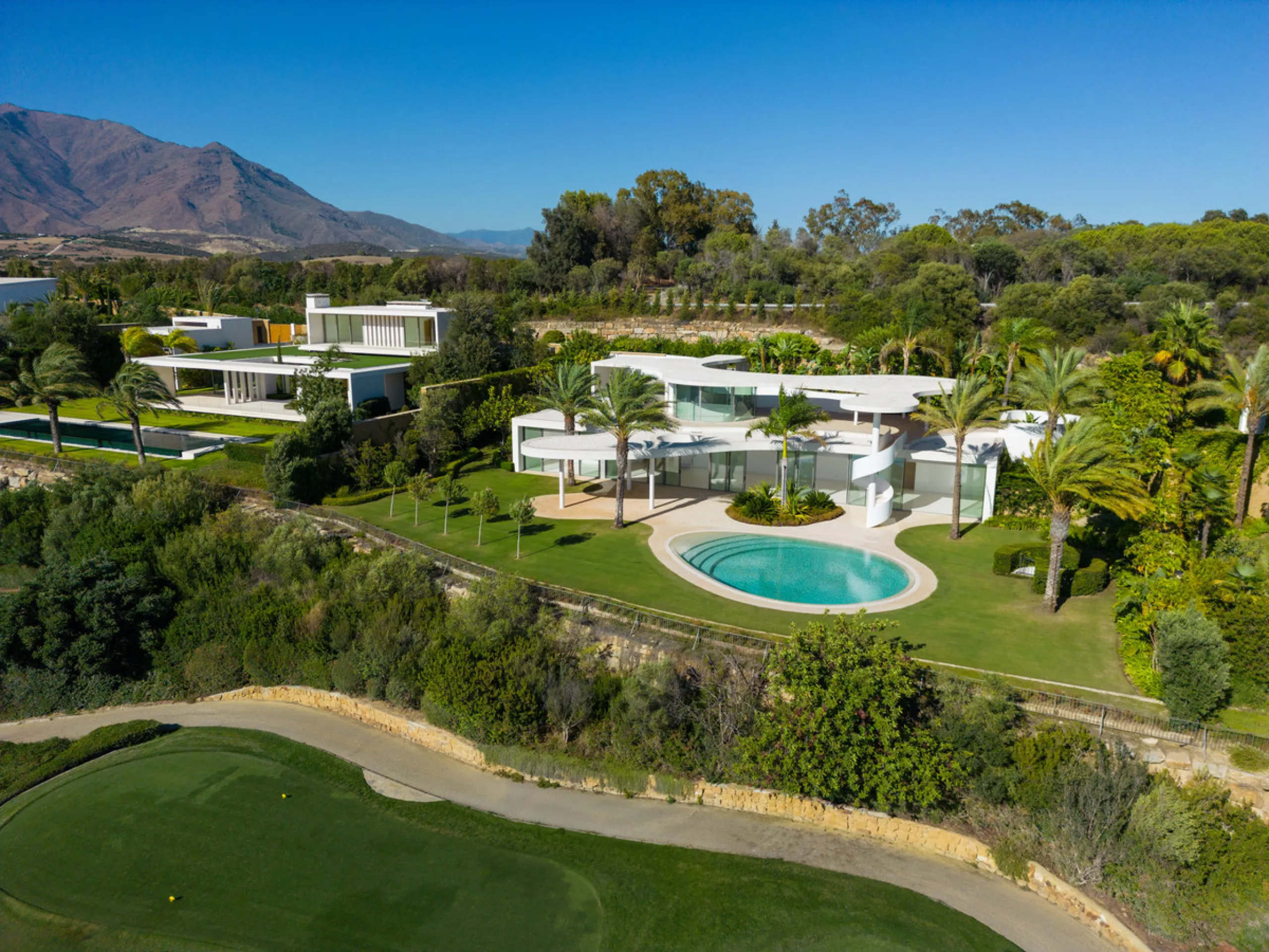 This prestigious villa stands as a testament to architectural ingenuity, capturing the essence of uniqueness and sophistication. Designed by the visionary minds of Vicens & Ramos architects, its futuristic yet nostalgic structure commands attention with i