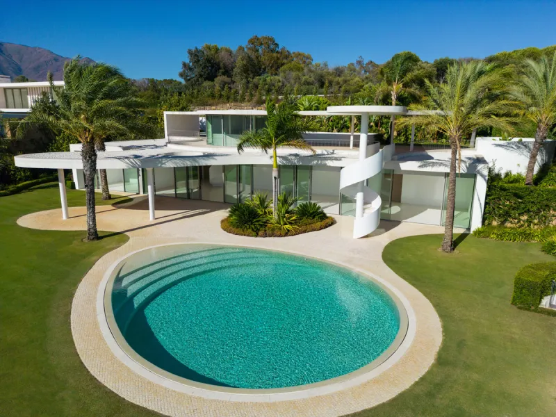 This prestigious villa stands as a testament to architectural ingenuity, capturing the essence of uniqueness and sophistication. Designed by the visionary minds of Vicens & Ramos architects, its futuristic yet nostalgic structure commands attention with i