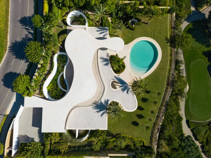This prestigious villa stands as a testament to architectural ingenuity, capturing the essence of uniqueness and sophistication. Designed by the visionary minds of Vicens & Ramos architects, its futuristic yet nostalgic structure commands attention with i