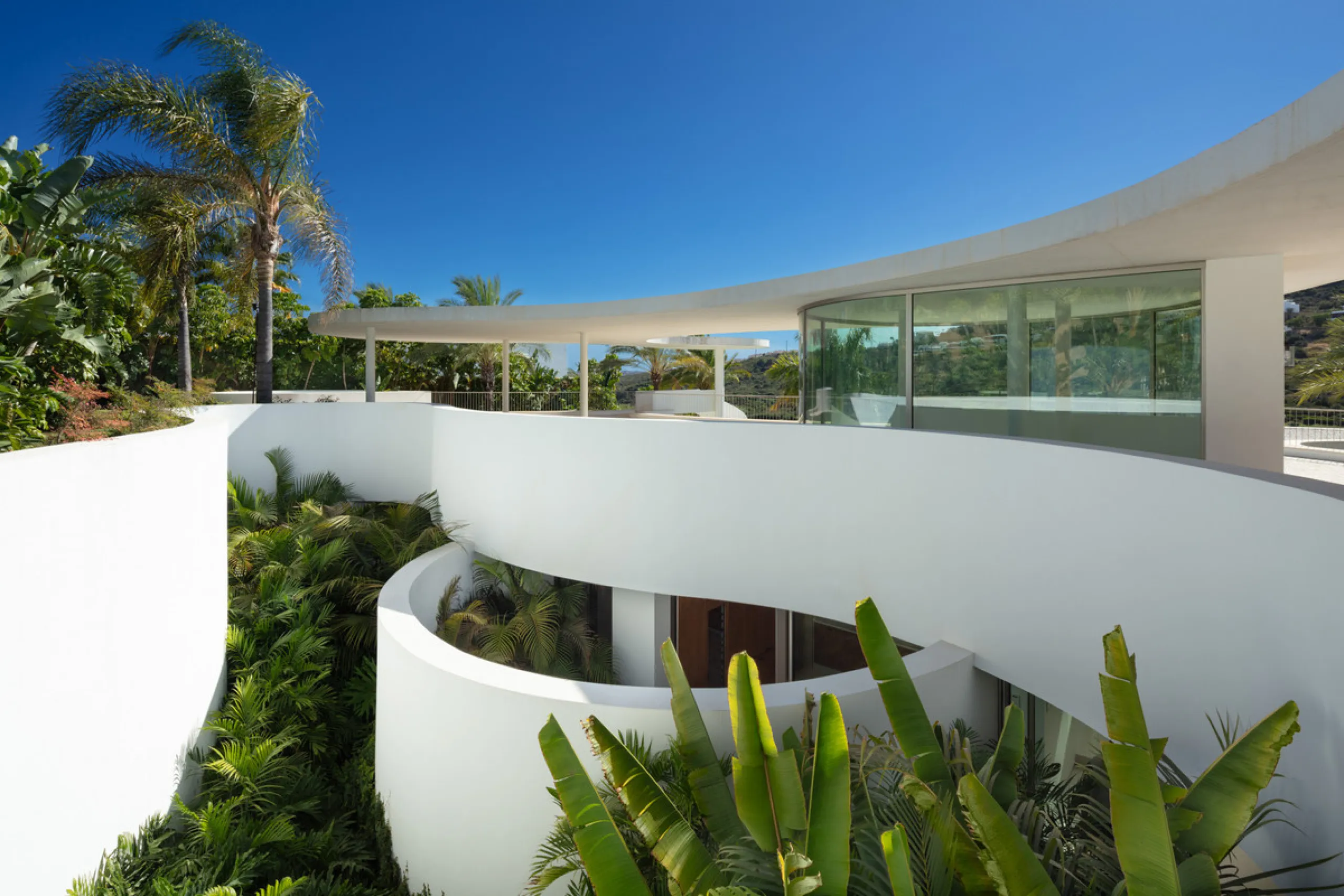 This prestigious villa stands as a testament to architectural ingenuity, capturing the essence of uniqueness and sophistication. Designed by the visionary minds of Vicens & Ramos architects, its futuristic yet nostalgic structure commands attention with i