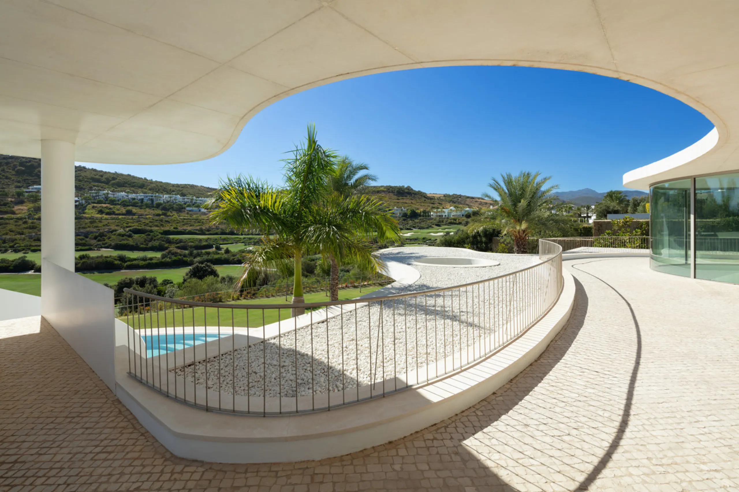 This prestigious villa stands as a testament to architectural ingenuity, capturing the essence of uniqueness and sophistication. Designed by the visionary minds of Vicens & Ramos architects, its futuristic yet nostalgic structure commands attention with i