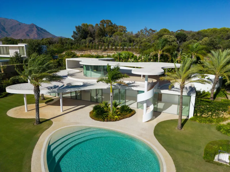 This prestigious villa stands as a testament to architectural ingenuity, capturing the essence of uniqueness and sophistication. Designed by the visionary minds of Vicens & Ramos architects, its futuristic yet nostalgic structure commands attention with i